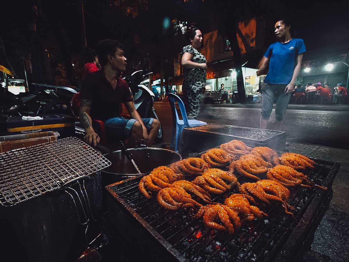 Grilling octopus at Oc Oanh in Ho Chi Minh City