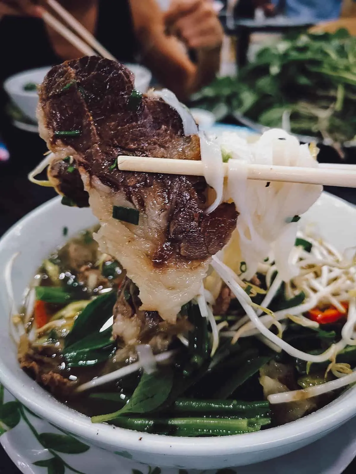 Slice of beef inside pho at Pho Le restaurant in Saigon