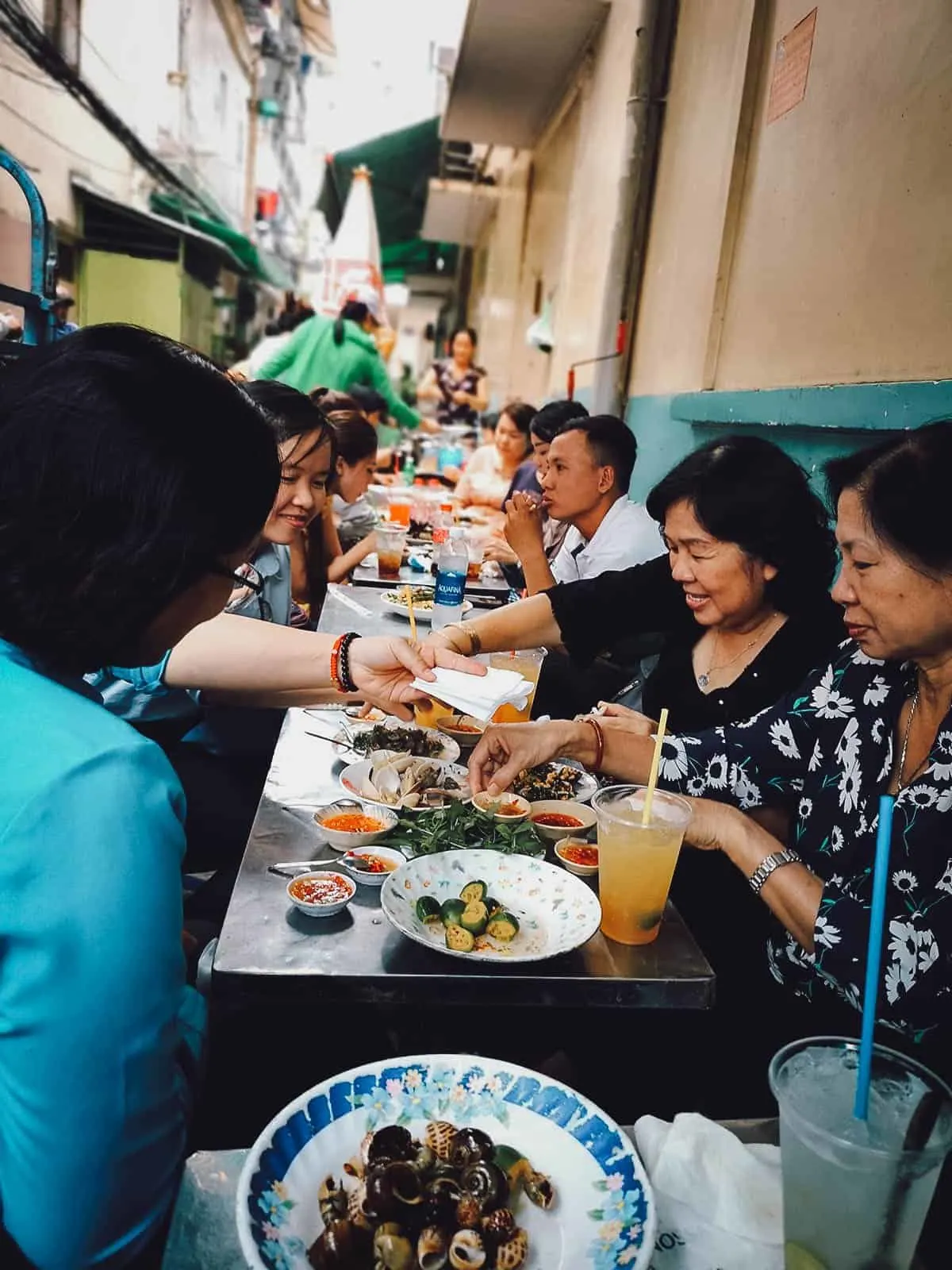 Diners ar Mrs Truoc's Snail Stall in Saigon