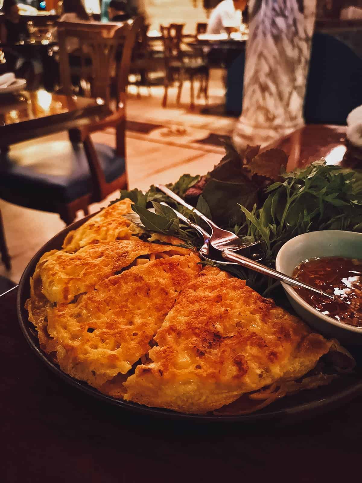 Banh xeo with fish sauce at Vietnam House Restaurant in Ho Chi Minh City