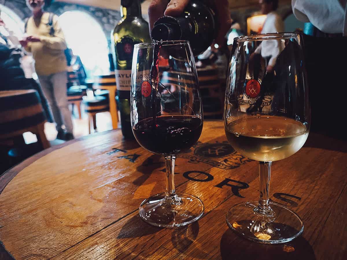 Glasses of red and white dessert wine at a port winery in Porto