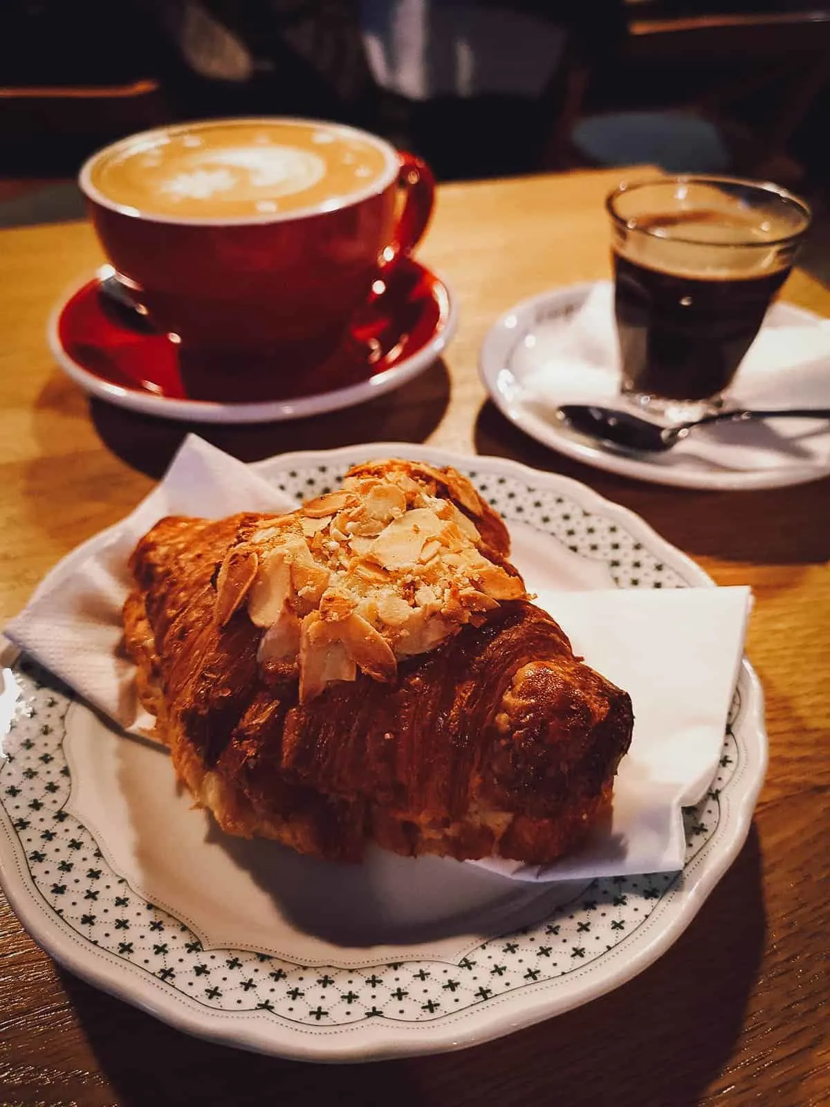 Coffee and croissant at 9BAR cafe in Budapest