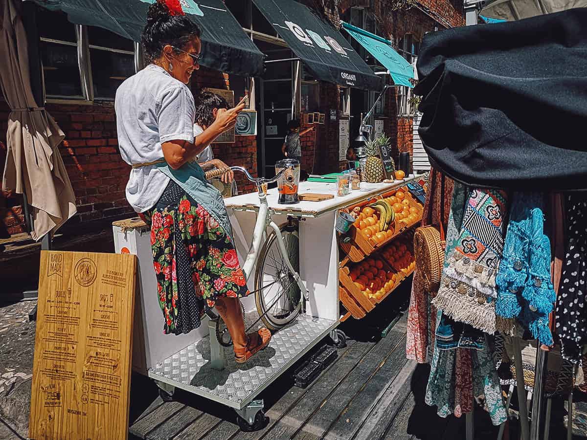 Woman making fresh fruit juice