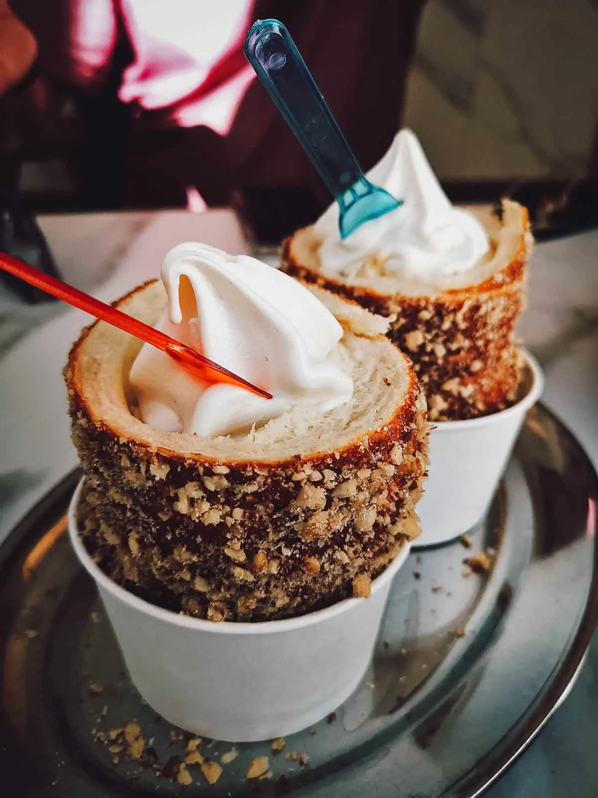 Hungarian chimney cakes with soft serve ice cream at Molnar's Kurtoskalacs in Budapest, Hungary