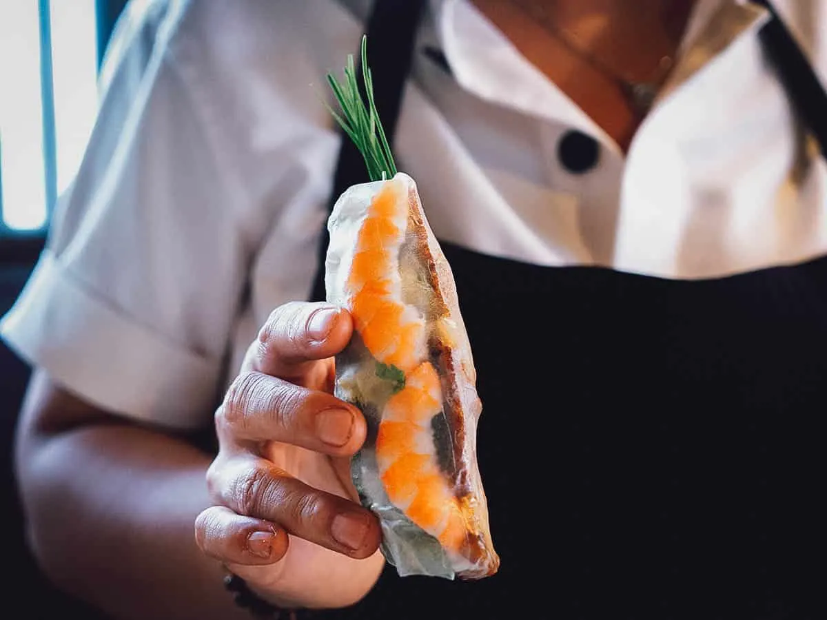 Vietnamese cooking class Woman holding a fresh spring roll