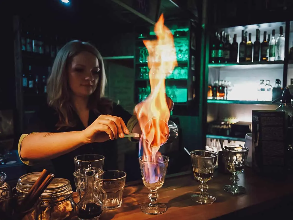 Bartender preparing absinthe drink at Absintherie in Prague, Czechia