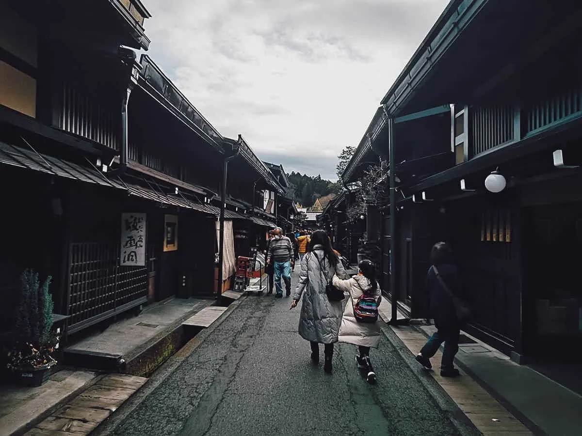 Woman walking along Sanmachi Suji
