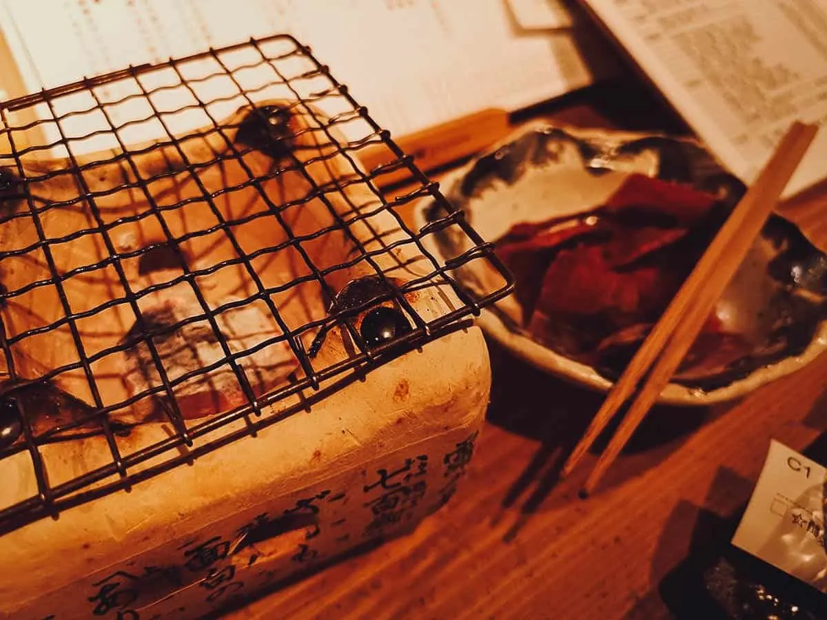 Smoked fish and small charcoal grill at a restaurant in Kyoto