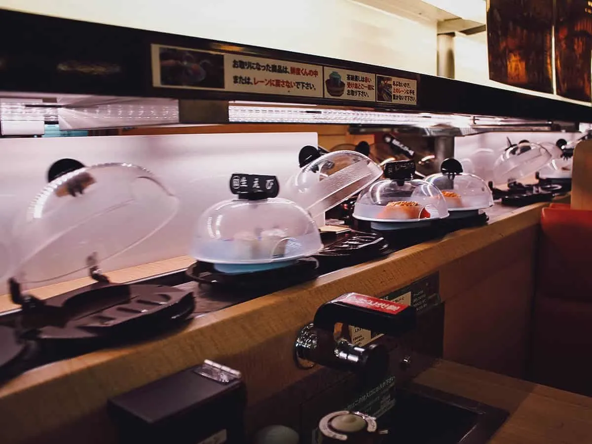 Sushi going around the conveyor belt at a restaurant in Kyoto