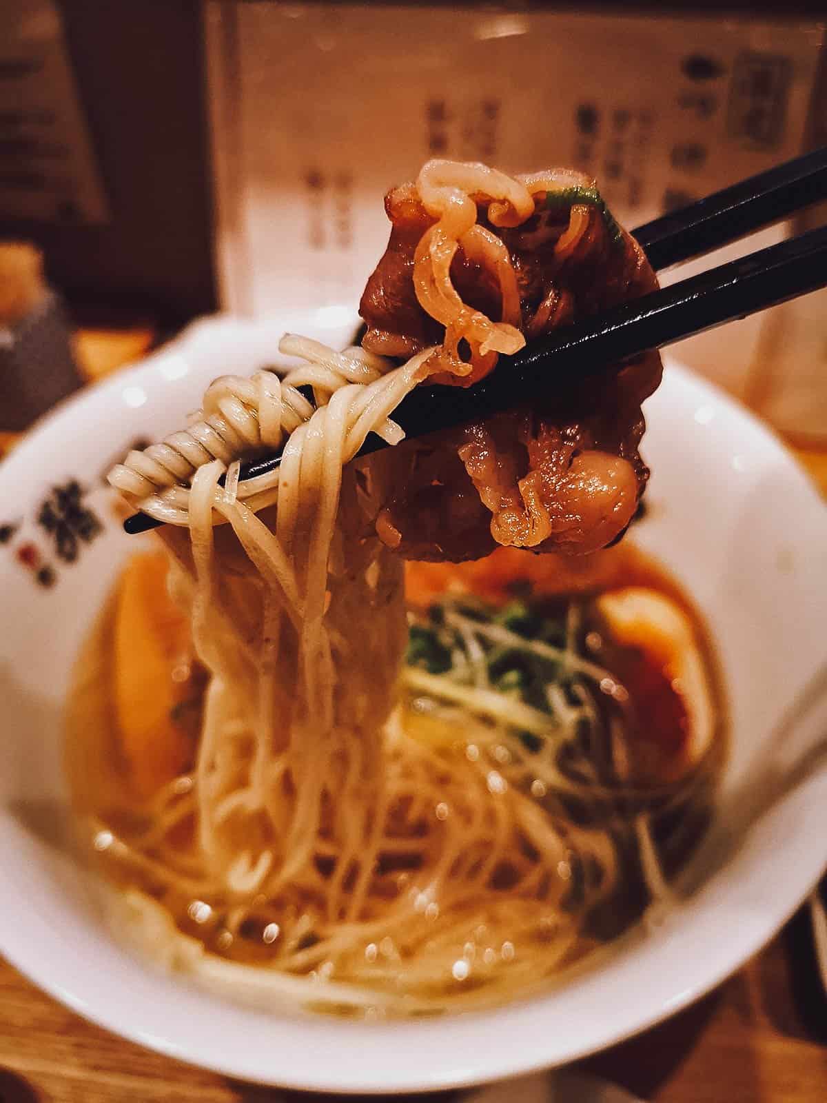 Picking up ramen noodles and beef at a restaurant in Kyoto