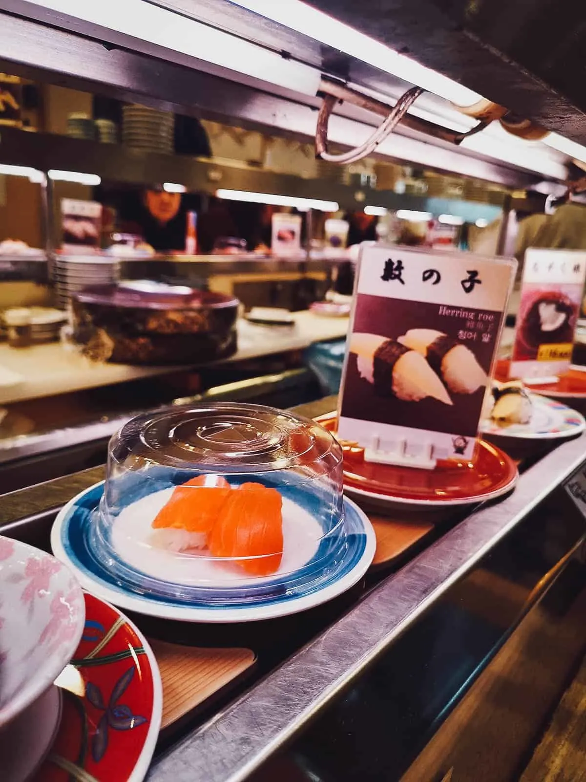 Sushi going around the conveyor belt at a restaurant in Kyoto