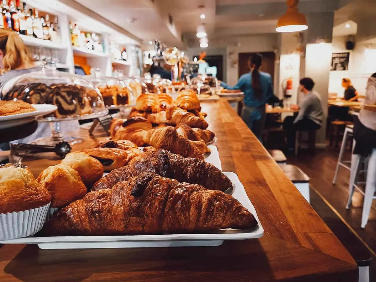Pastries on counter and restaurant interior