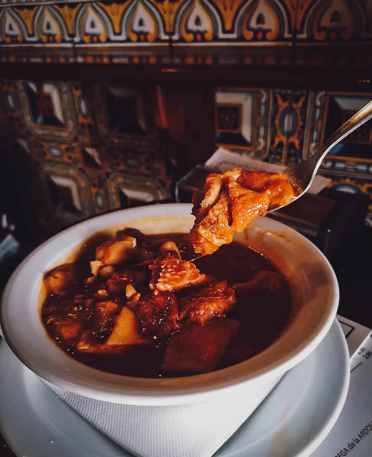 Madrid Food Guide: 14 Must-Try Restaurants, Bars, and Markets Wall of liquor bottles