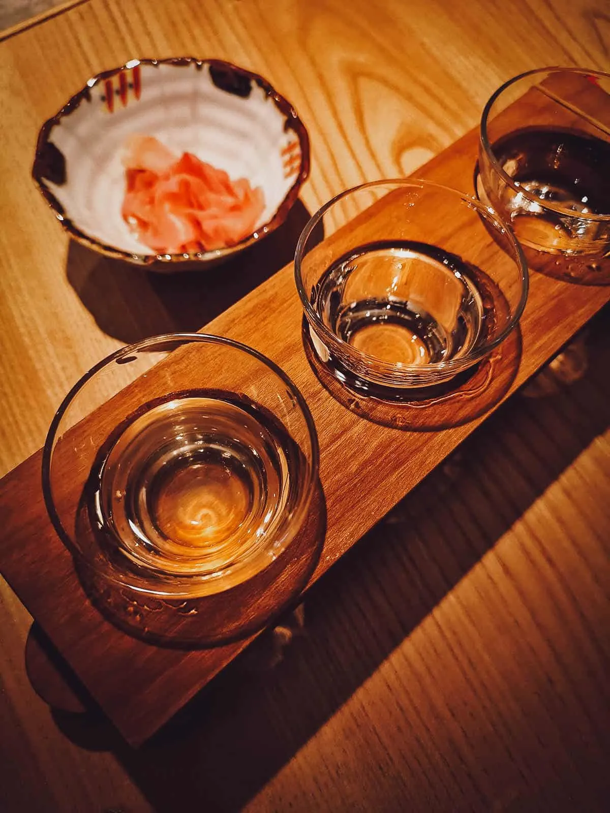 Flight of sake with gari or pickled ginger