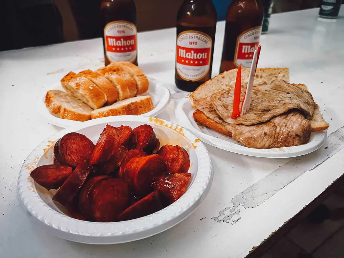 Lomo, chorizo, bread, and beer