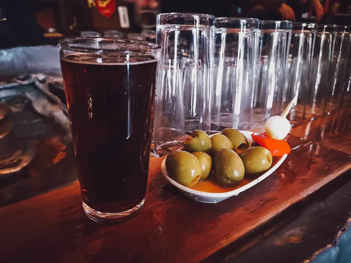 Glass of vermouth and olives