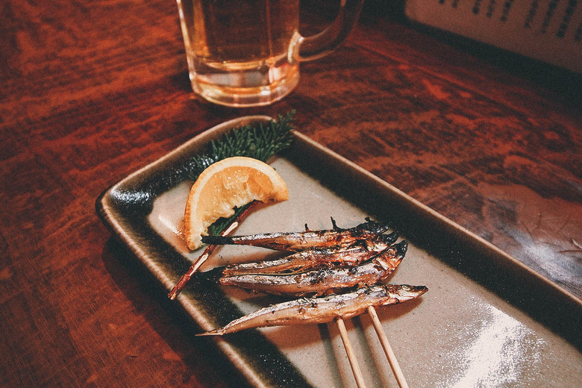 Skewered fish inside a yatai stall in Fukuoka