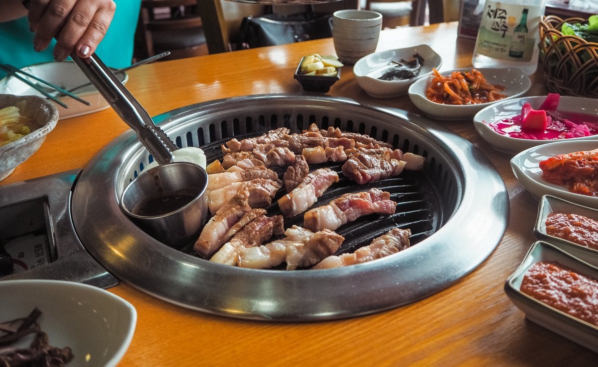 Grilling black pork on Jeju Island