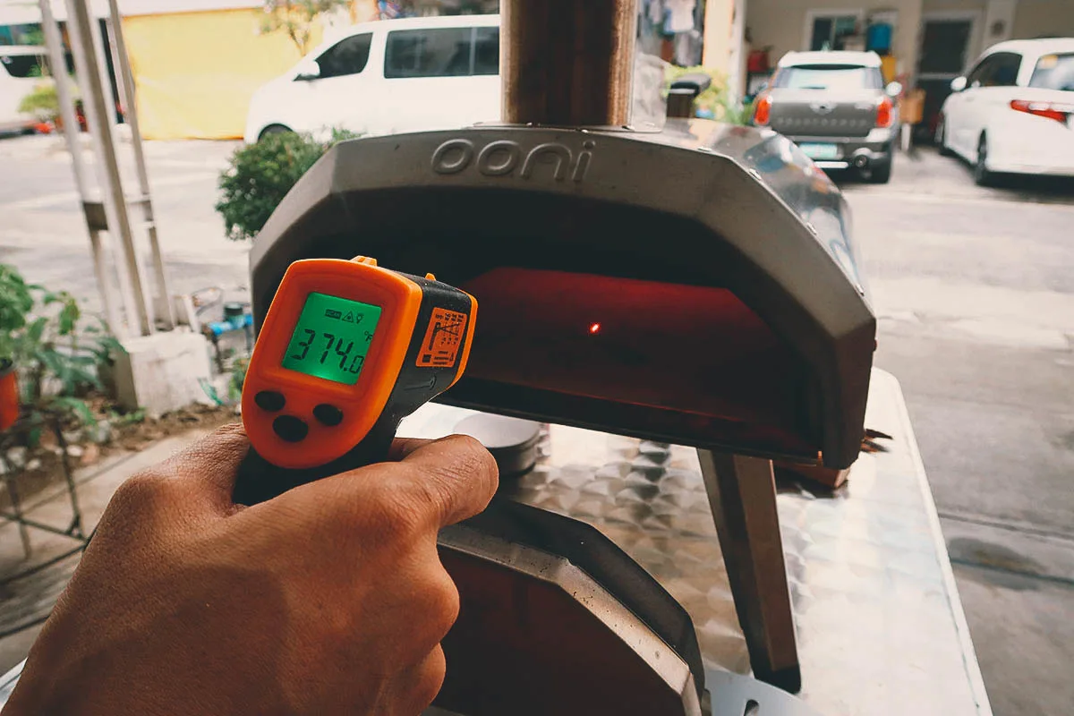 Checking the temperature of the pizza stone