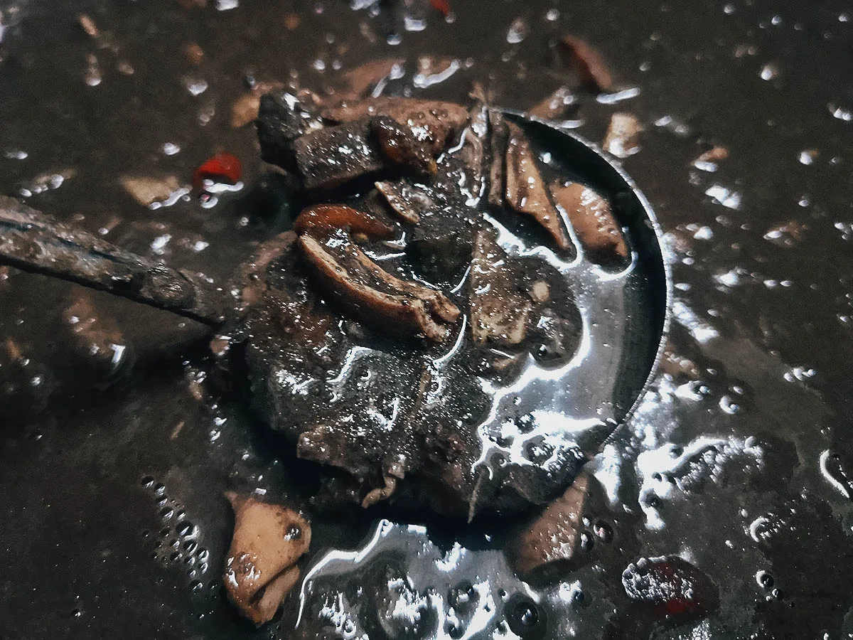 Filipino Food Guide Dinuguan with rice cake, an interesting dish in the Philippines