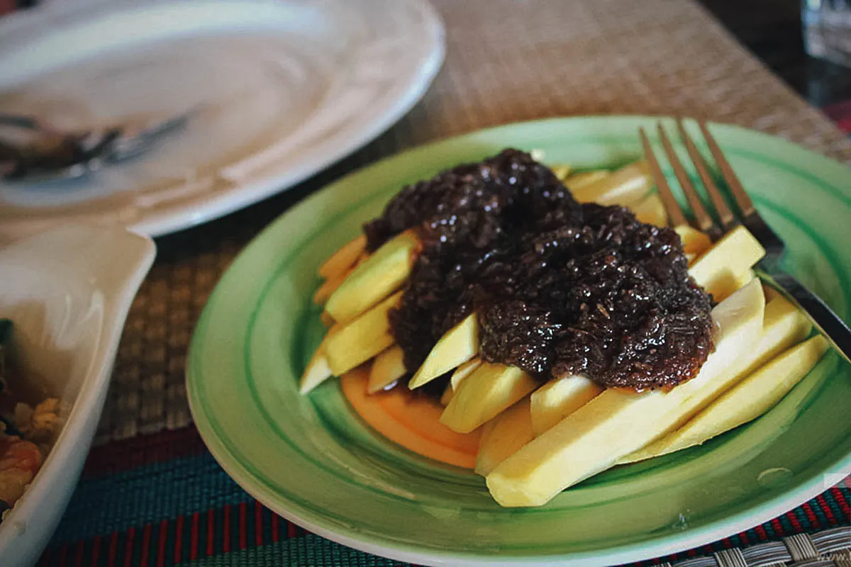 Manga at bagoong or green mangoes with fermented shrimp paste, a popular street food dish in the Philippines