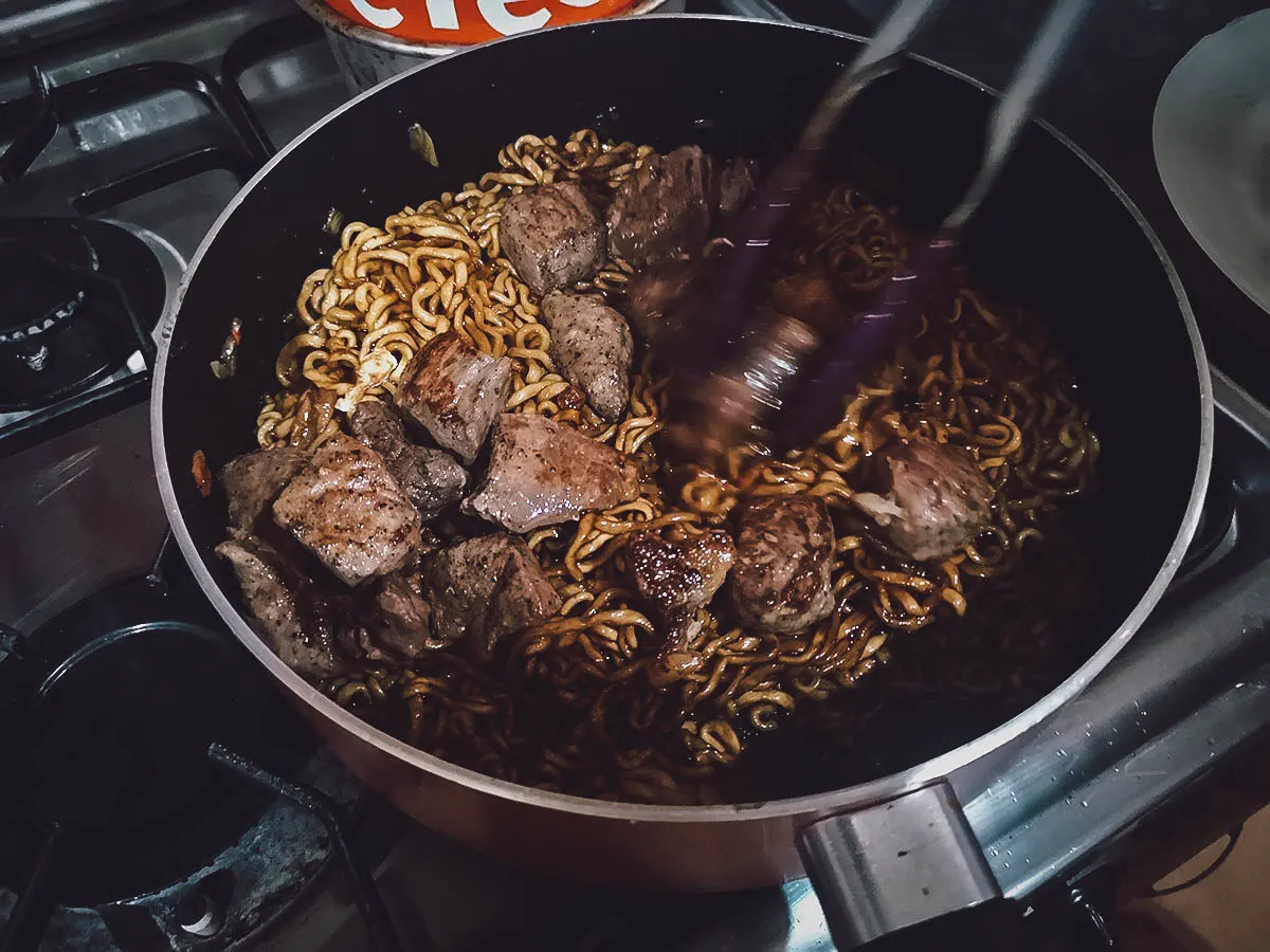 Ram-Don Recipe Adding the steak cubes to the noodles