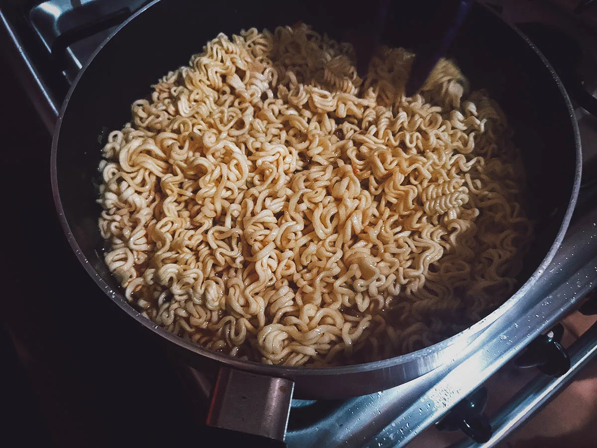 Adding the noodles into the pot