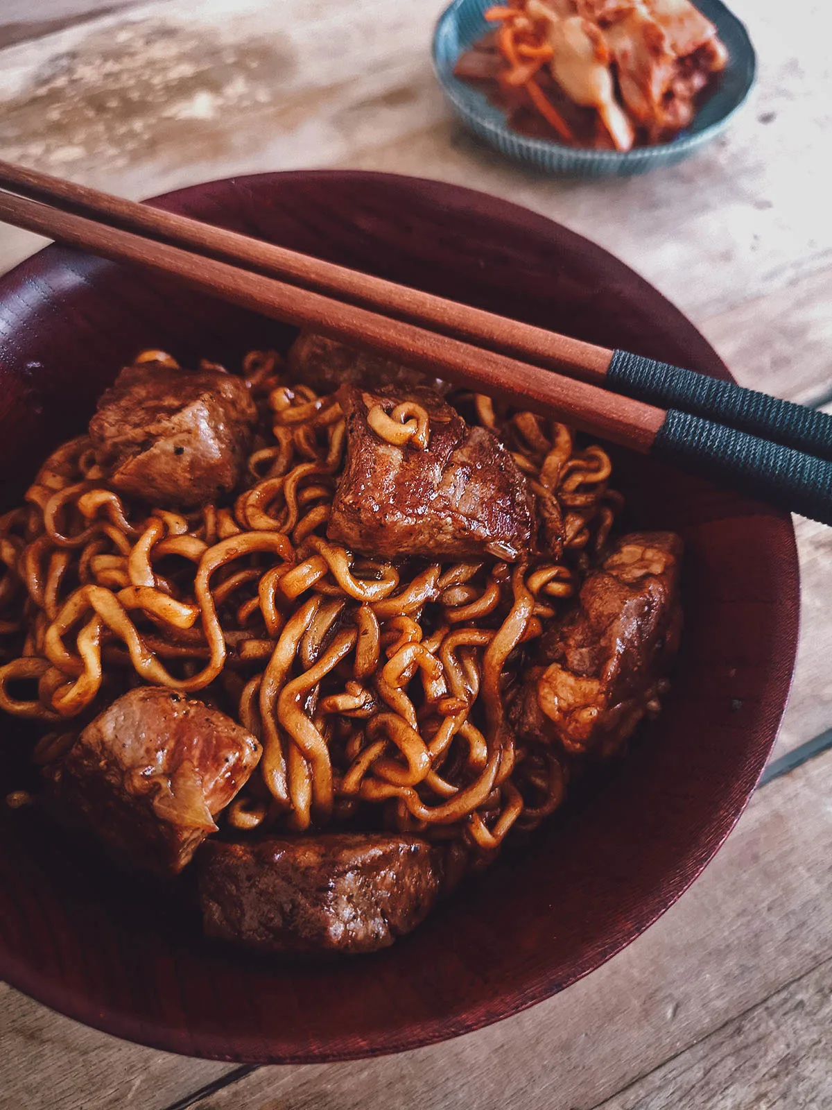 Bowl of ram-don with a side of kimchi