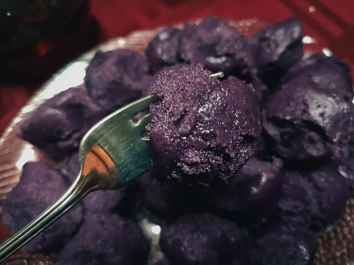 Filipino Food Guide Putong ube or Filipino rice cake made with ube