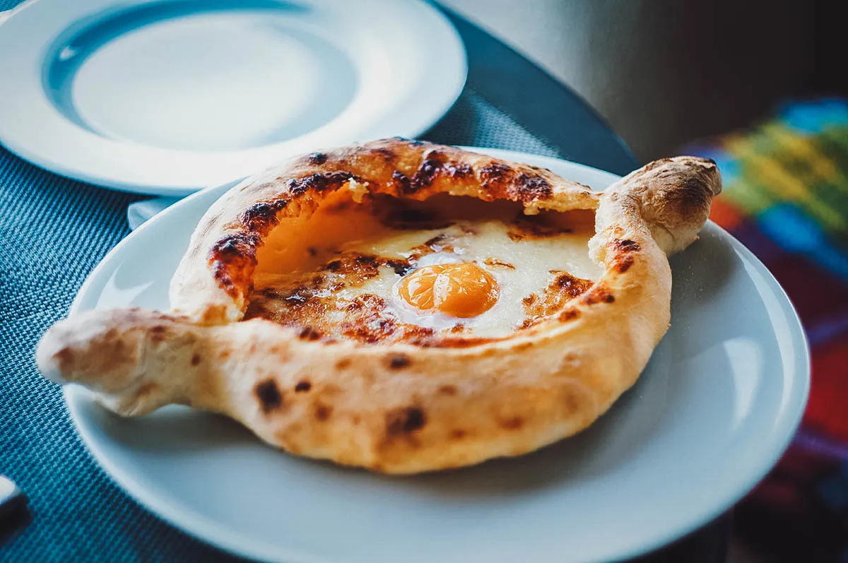 Georgian Food Adjarian Khachapuri, a boat-shaped Georgian khachapuri