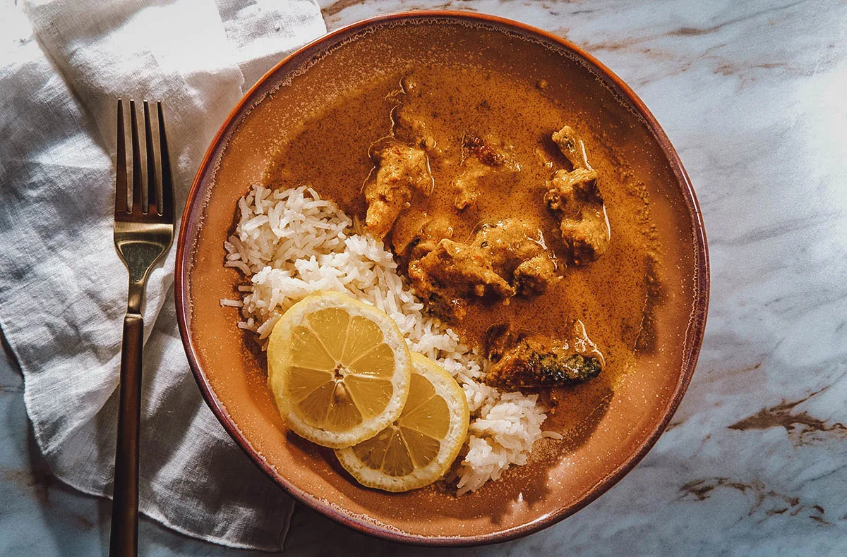 Kenyan Food Kuku paka, a Kenyan chicken dish cooked in a coconut curry sauce