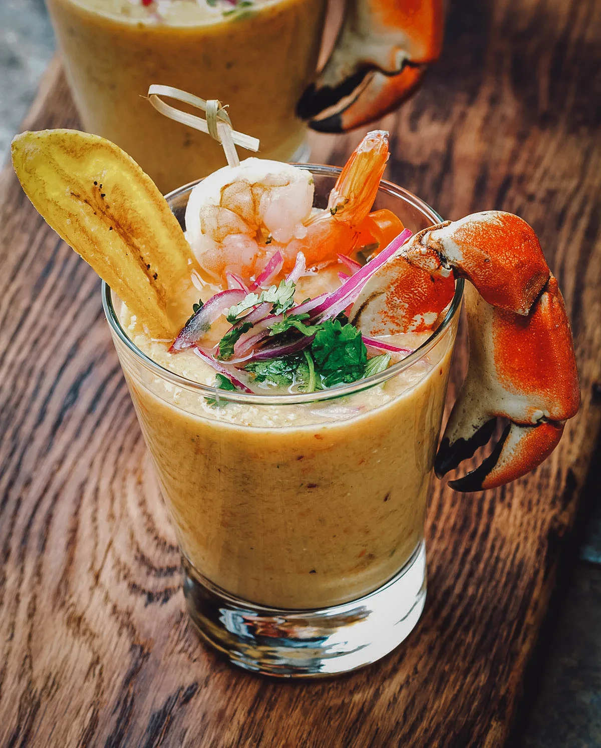 Glass of leche de tigre, a popular Peruvian drink made with ceviche