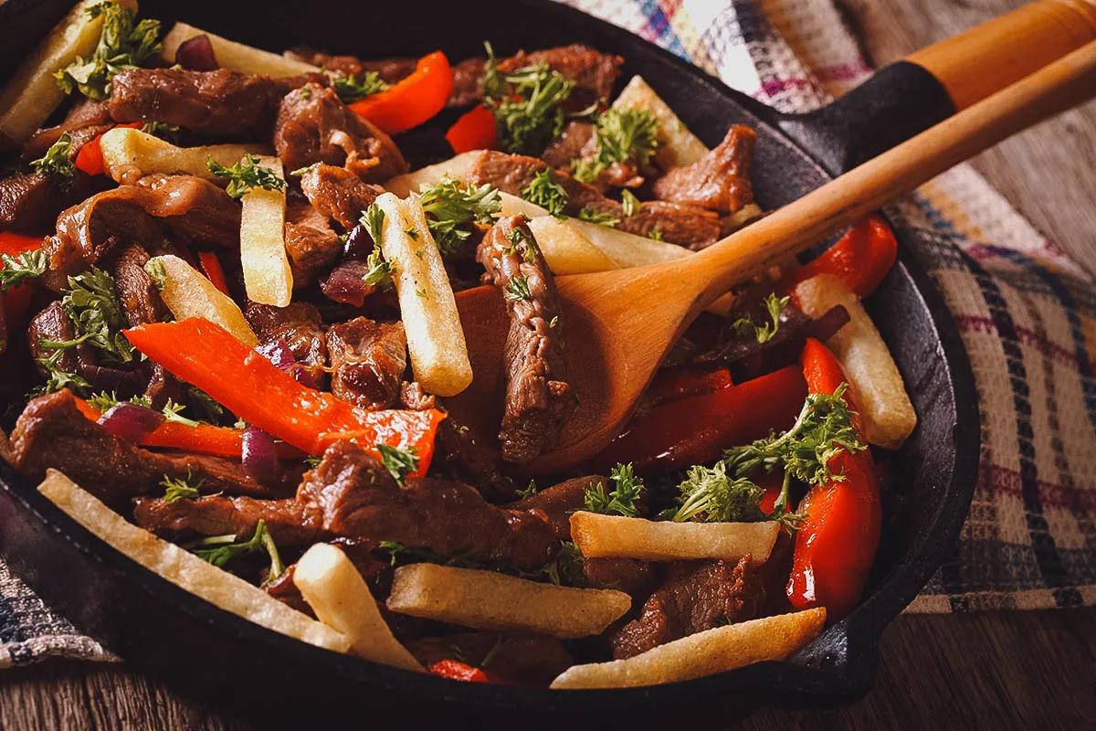 Peruvian Food Lomo saltado, a popular stir-fry Peruvian-Chinese dish made with steak, fries, and soy sauce