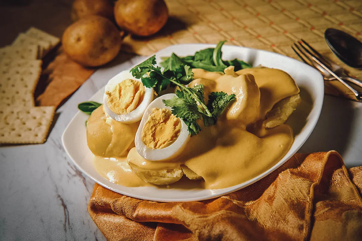 Peruvian Food Papas a la Huancaina, one of the most popular Peruvian foods served at railway stations