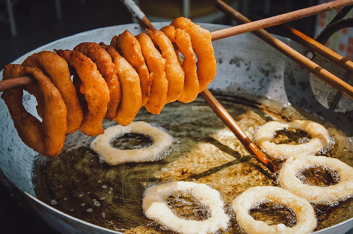 Frying picarones or Peruvian doughnuts