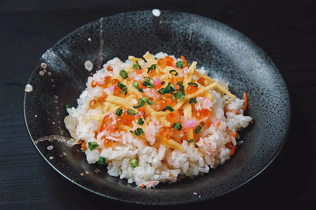 Bowl of chirashi sushi, a type of sushi made with different ingredients scattered over vinegar rice