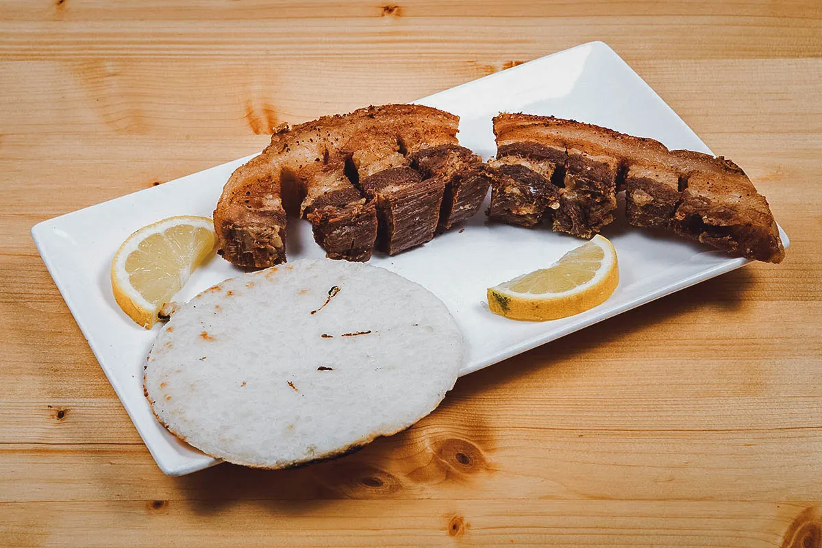 Venezuelan Food Chicharrones with arepa