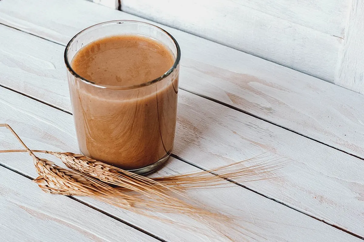 Glass of boza, an albanian drink made from fermented grains