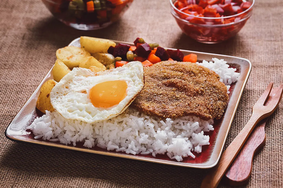 Silpancho, a heavy Bolivian dish of rice, beef, and vegetables