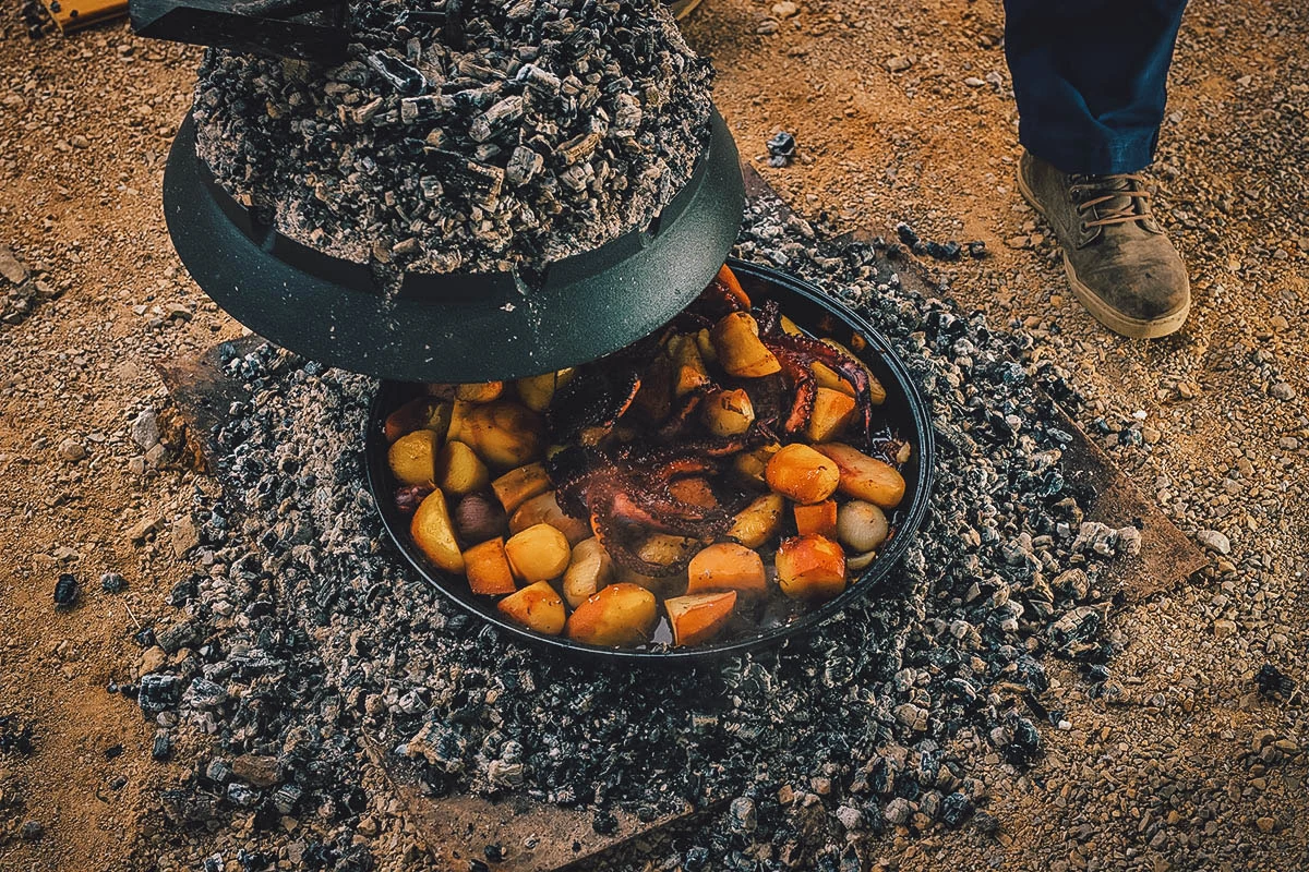 Croatian Food Peka, a primitive convection oven for evenly cooking seafood, meat, and other Croatian dishes