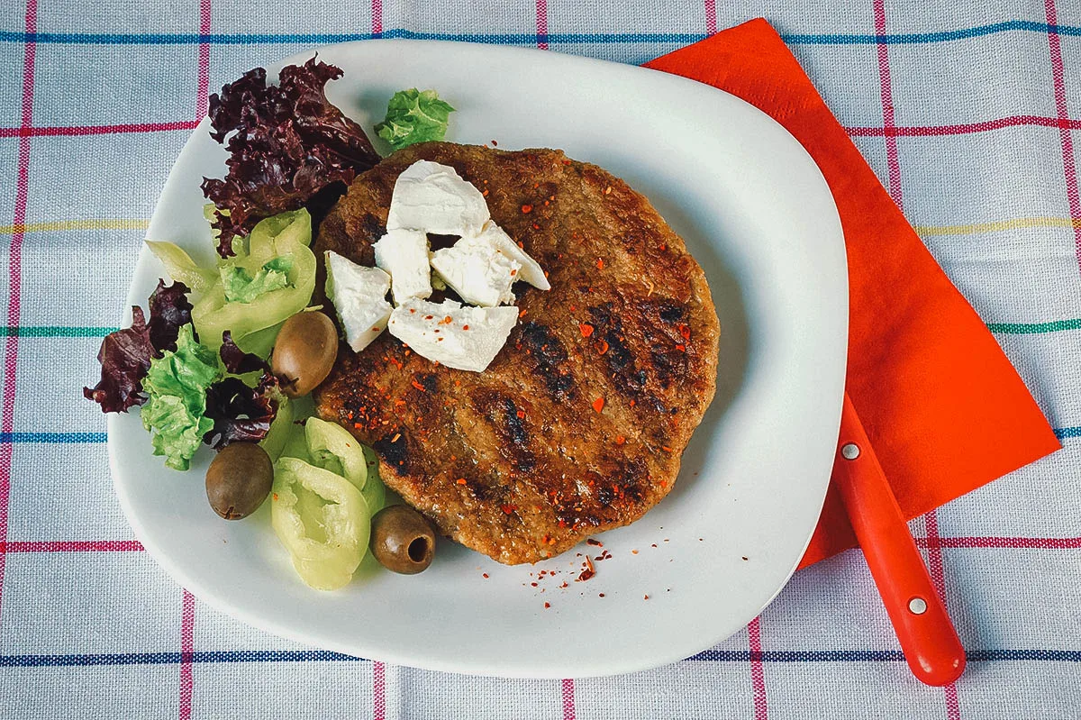 Bosnian Food Pljeskavica with salad and cheese