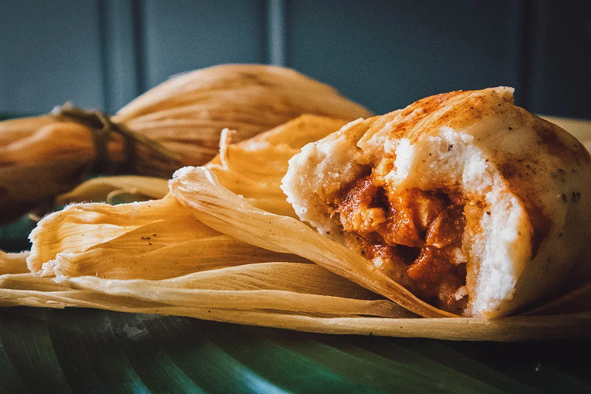 Guatemalan Food Chuchitos, a popular street food in Guatemala made with chicken and tomato sauce