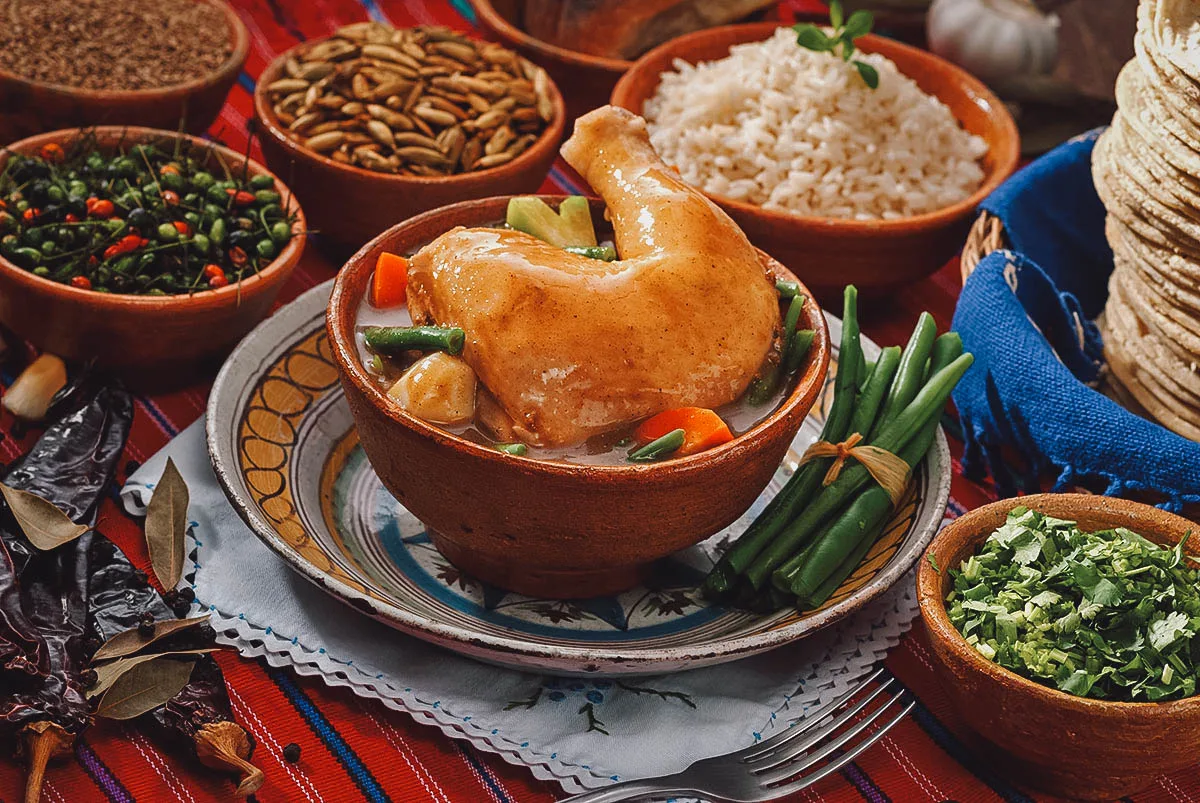 Guatemalan Food Pepian de indio, a Guatemalan national dish made with chicken in tomato sauce