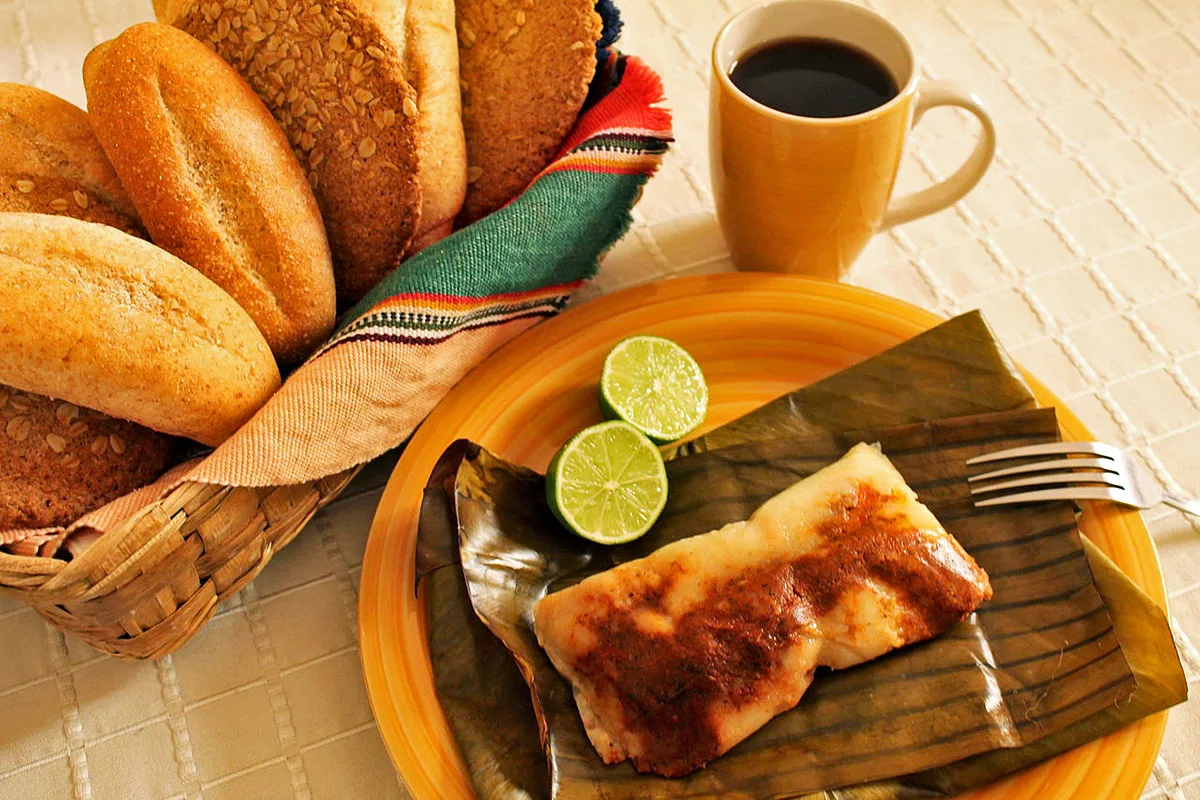 Guatemalan Food Tamal colorado, a popular type of red tamales in Guatemala