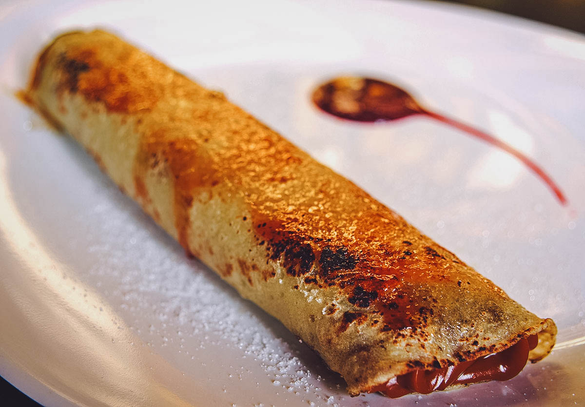 Panqueque filled with dulce de leche on a plate