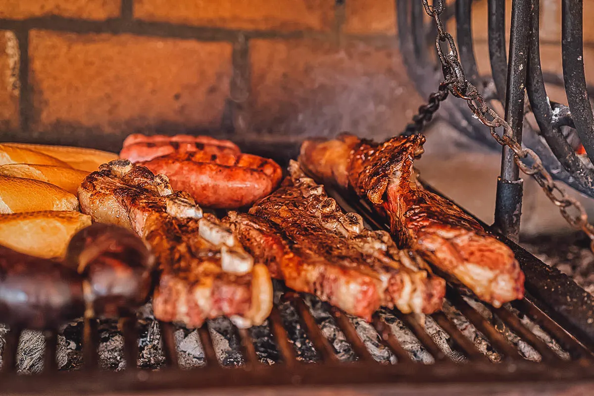 Argentinian Food Ribs, blood sausage, and chorizo on a grill, classic components to an asado or Argentinian barbecue