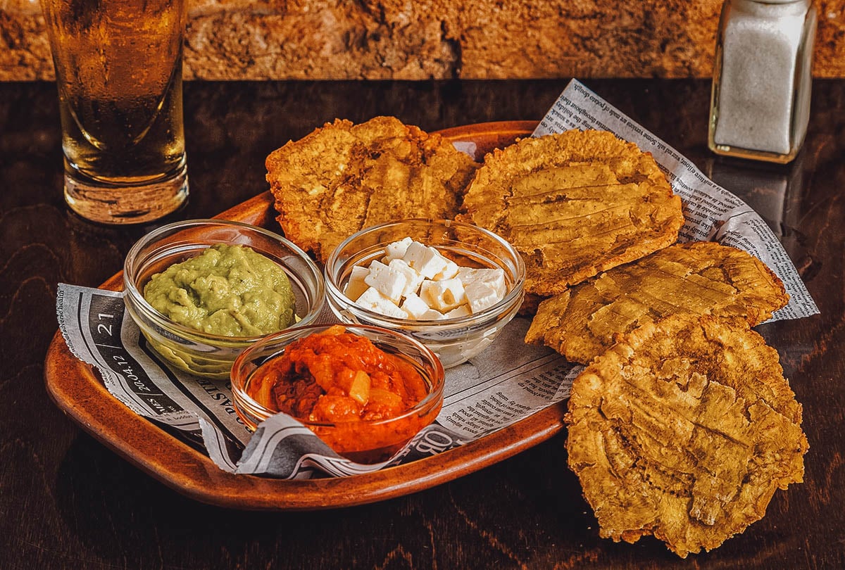 Plate of patacones with pico de gallo and guacamole at a bar in Costa Rica