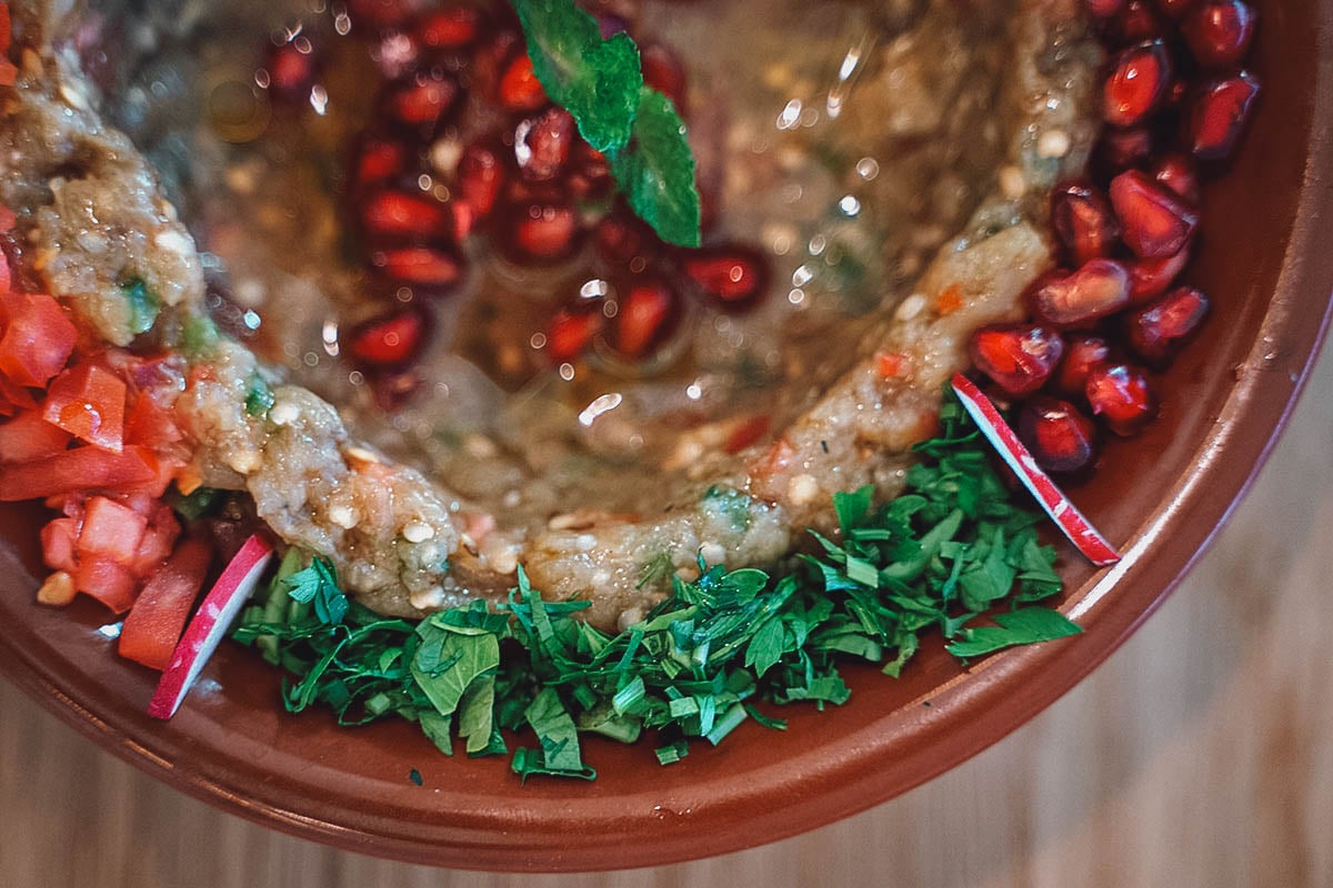 Earthenware pot of baba ghanoush, a popular Egyptian dip made with roasted eggplant