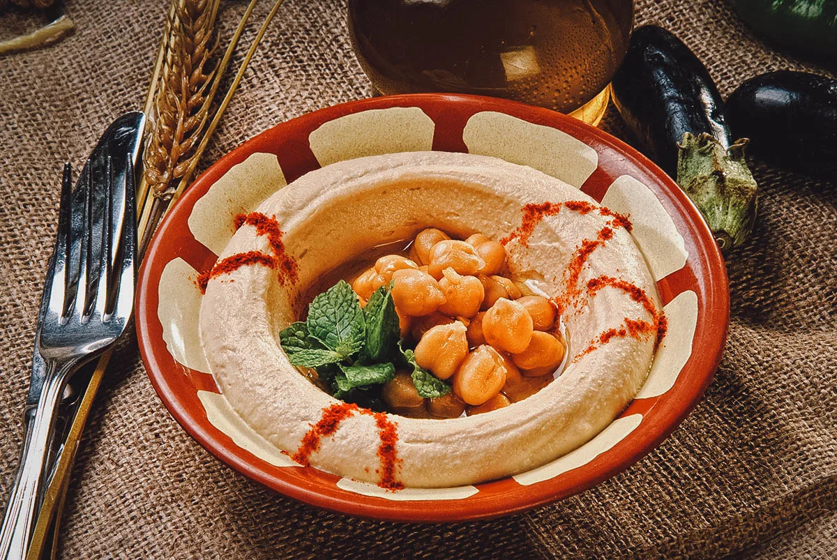 Earthenware pot of hummus, a popular Egyptian dip made with chickpeas