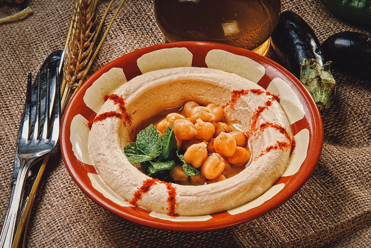 Egyptian Food Earthenware pot of hummus, a popular Egyptian dip made with chickpeas